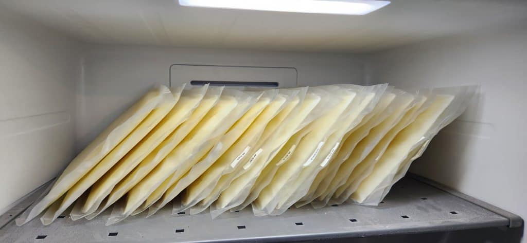 Raw Goat milk frozen into 10x13 sleeves and stored vertically in a freezer